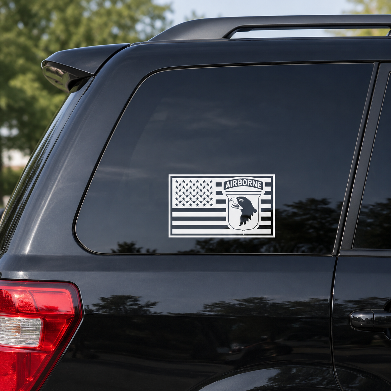 101st Airborne in US Flag vinyl decal displayed on a dark tinted SUV window