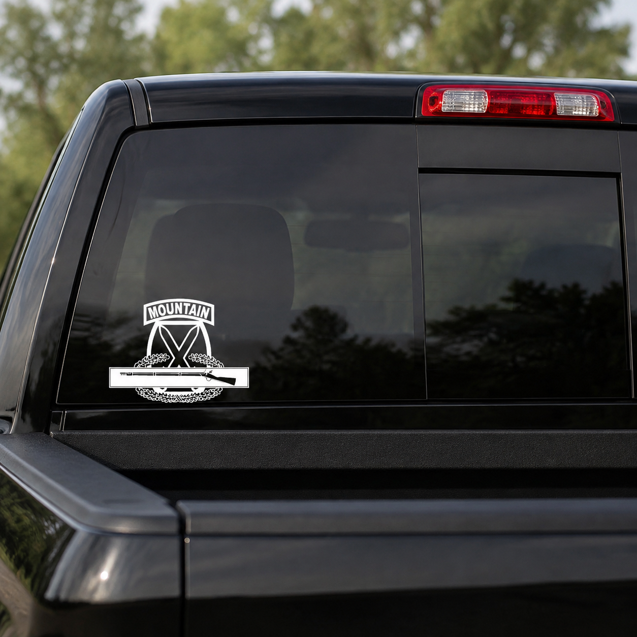 10th Mountain with Combat Infantry Badge CIB vinyl decal displayed on a dark tinted pickup rear window