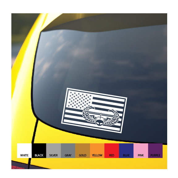 A vinyl decal of the US flag with an embedded air Assault badge, displayed on the rear window of a yellow vehicle, with color options shown in legends.