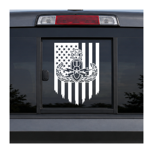 EOD Master badge on tattered US Flag