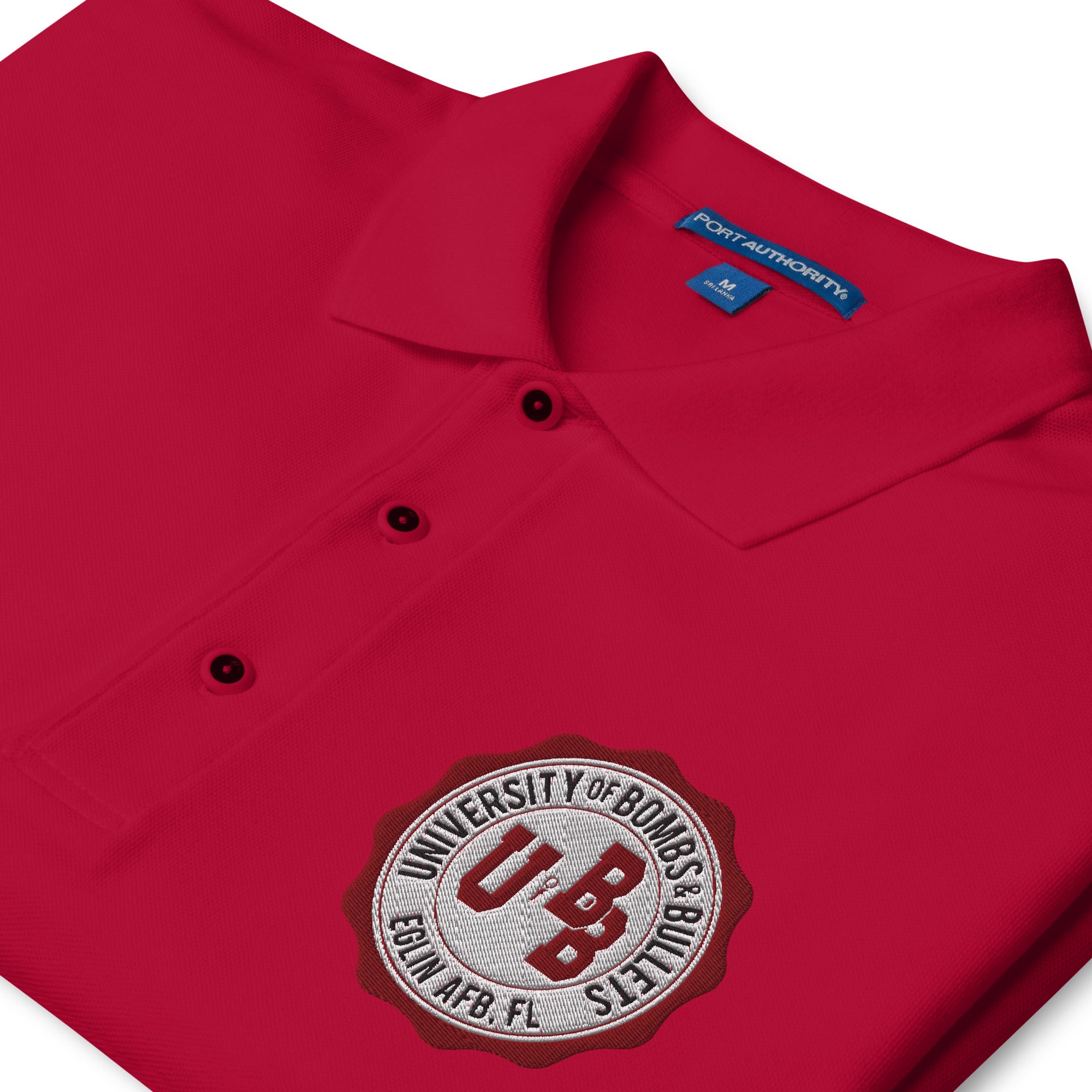 University of Bombs and Bullets Eglin premium polo