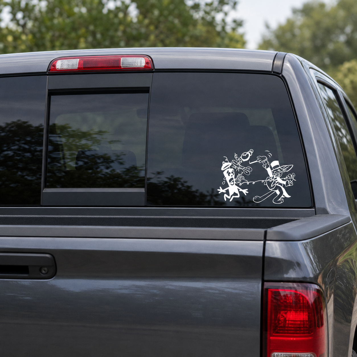 White WWII EOD Magic Rabbit vinyl decal displayed on a dark tinted pickup truck rear window