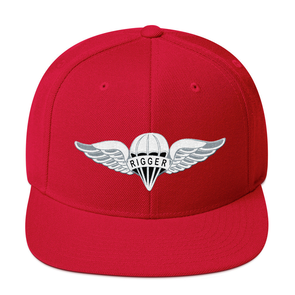 Red snapback hat with Rigger badge